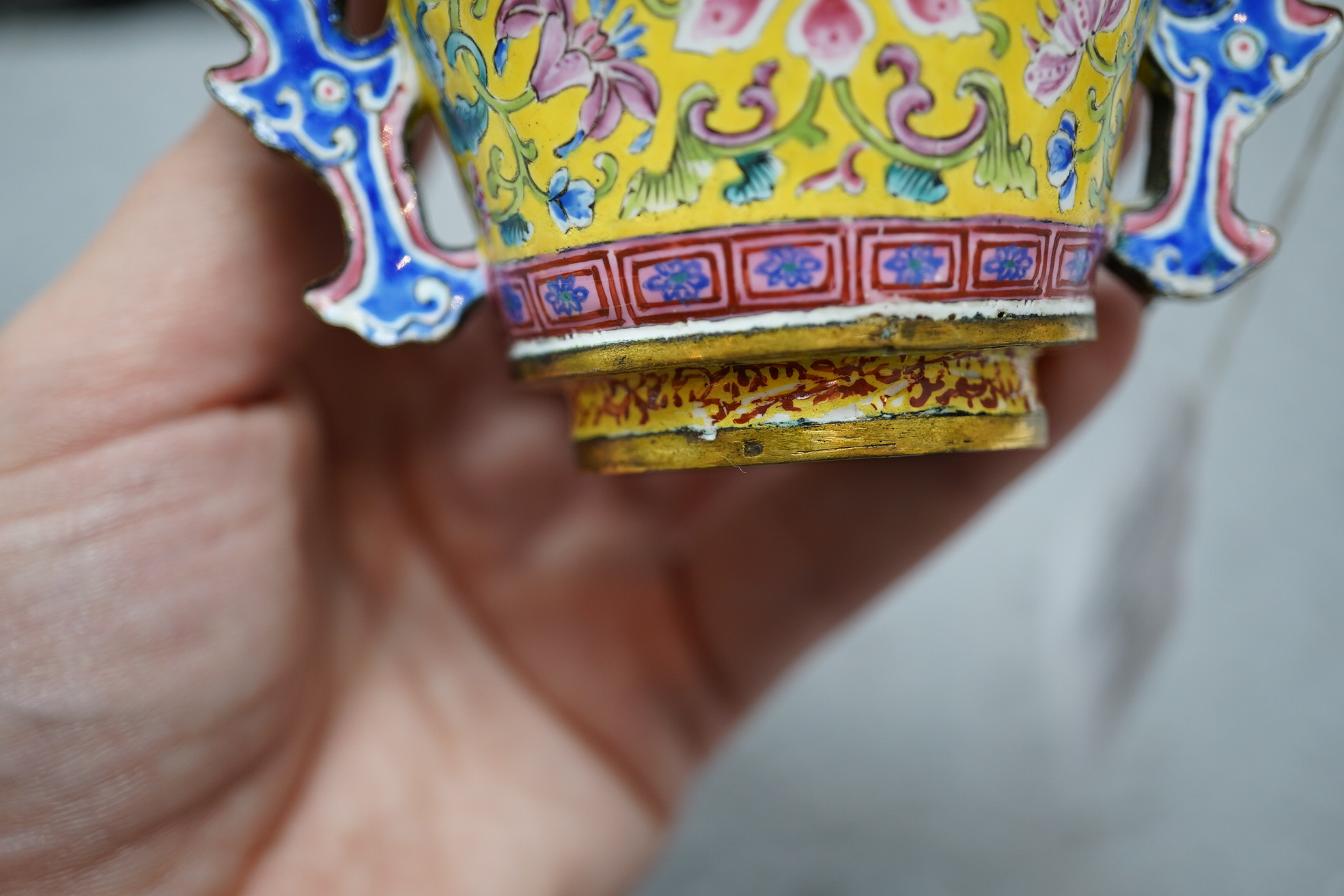 A Chinese Guangzhou enamel two handled wine cup, four character Qianlong mark and of the period (1736-1795)